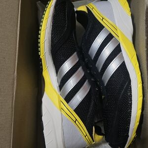 Adidas Black and Yellow Sneakers with Silver Stripes